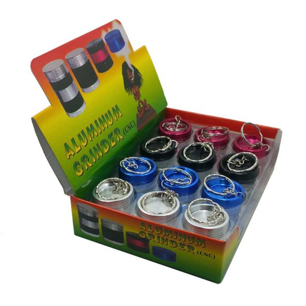 assorted mini keychain herb grinders with display case