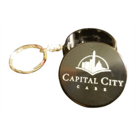 Mini 2-piece Capital City Care key chain grinders.
